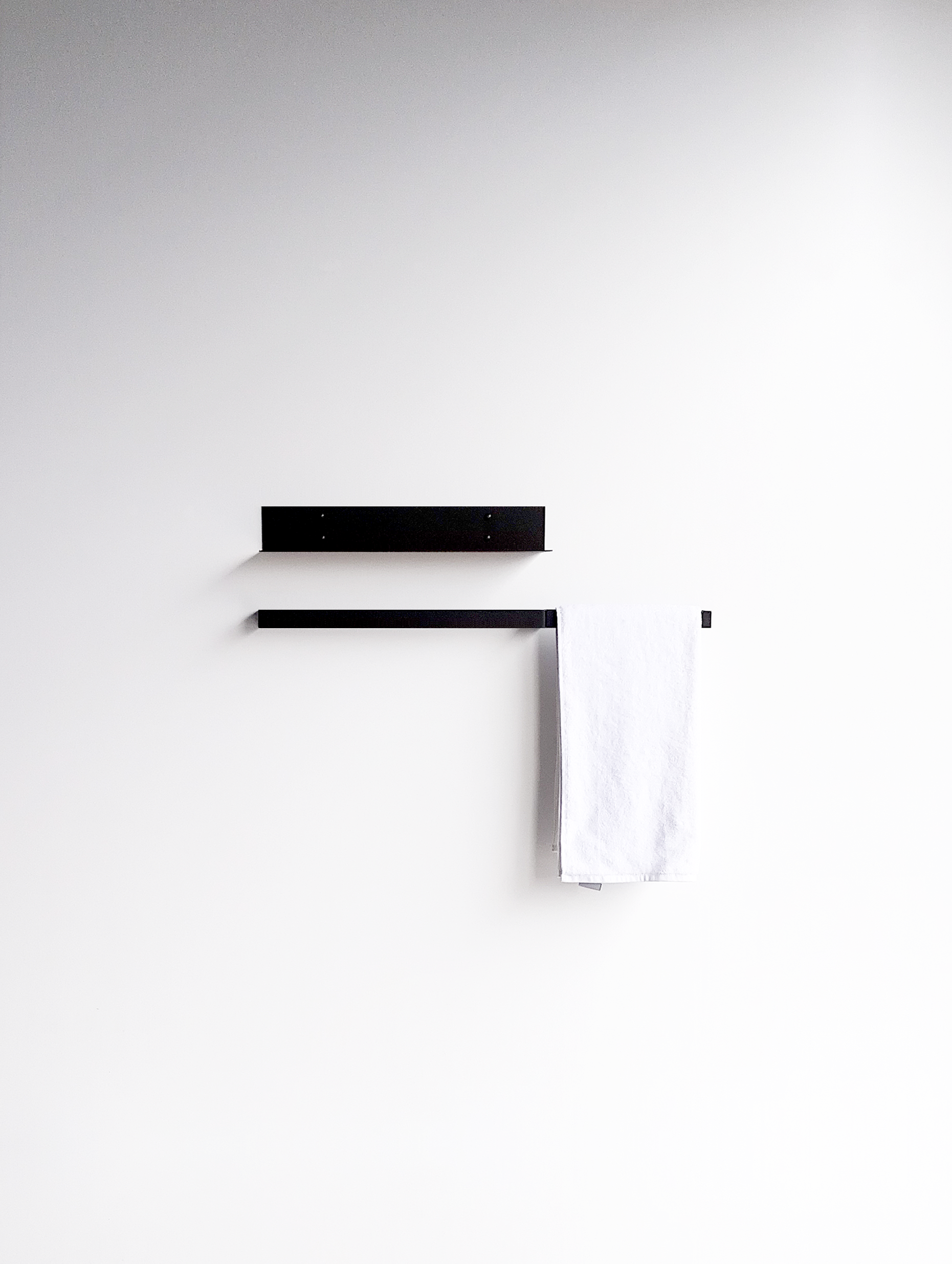 Black bathroom shelf and bath towel rail in bathroom design shop South Africa