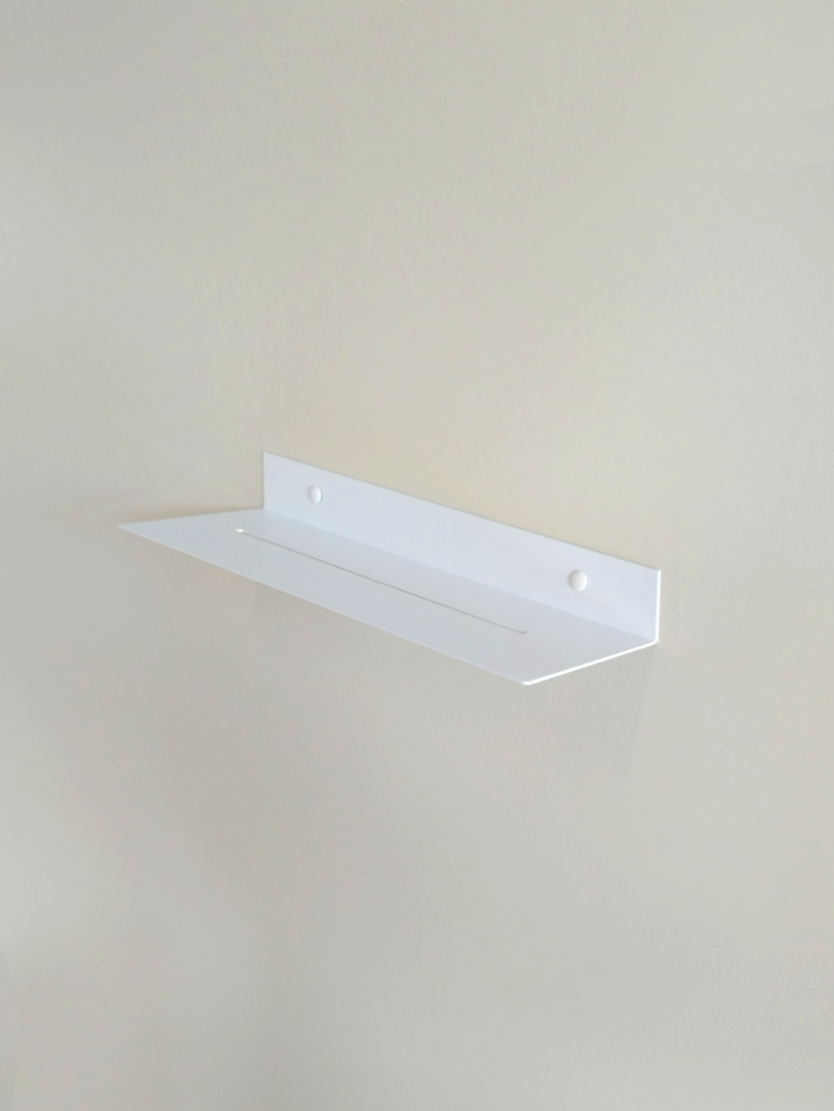 White steel shower shelf or shower caddy or white steel bathroom shelf in modern bathroom store in Johannesburg