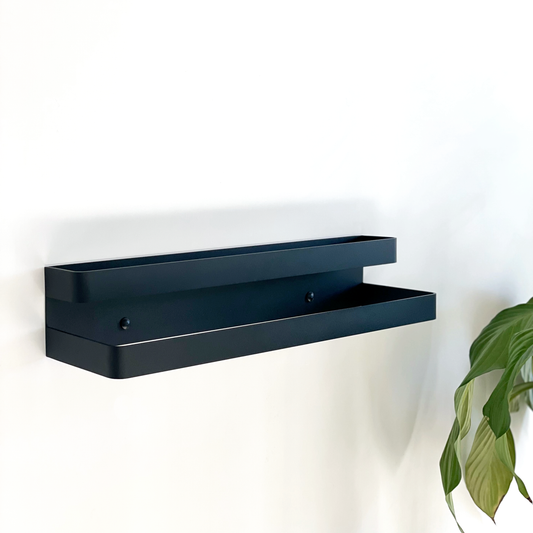 A Black steel towel ladder or a black steel towel rail in a modern bathroom design in a Tile Africa Store in Johannesburg